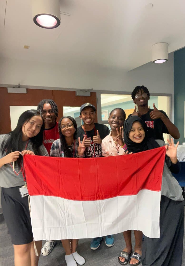 International delegates holding the Indonesian flag