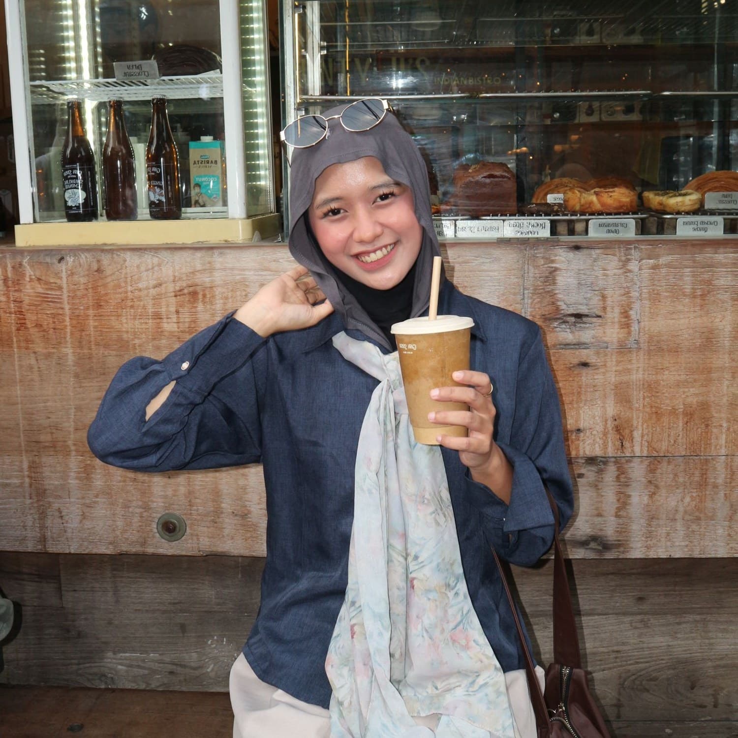 Ni'mah Shafwah Addini smiling at a coffee shop